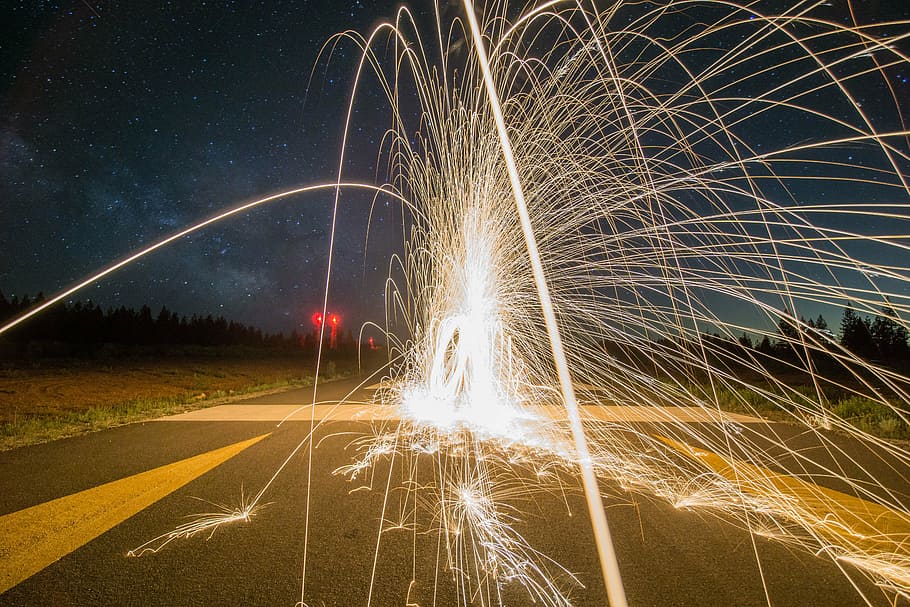 fountain firework on road, night, light, sparks, celebration HD wallpaper
