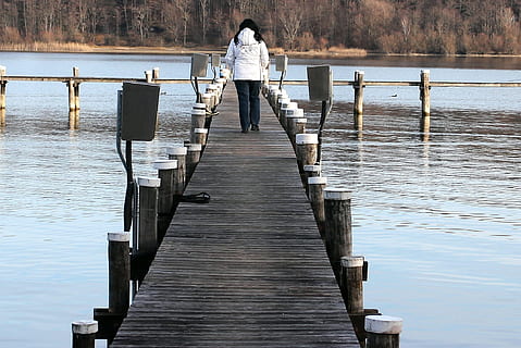 woman walking on wooden bridge on lake during daytime, Web HD wallpaper
