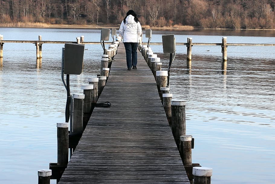 woman walking on wooden bridge on lake during daytime, Web HD wallpaper