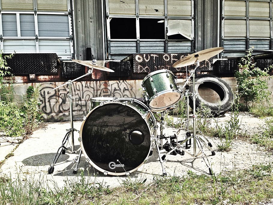 black and gray drum set across black tire, music, drums, old