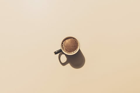 brown ceramic teacup, black ceramic coffee cup with brown liquid HD wallpaper