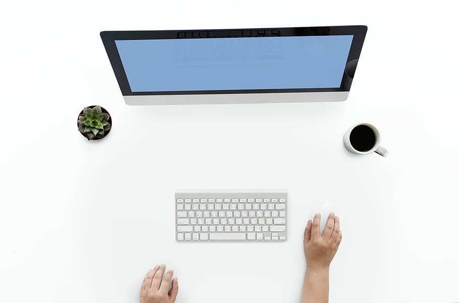 turned-on flat screen computer monitor and Apple Magic keyboard HD wallpaper