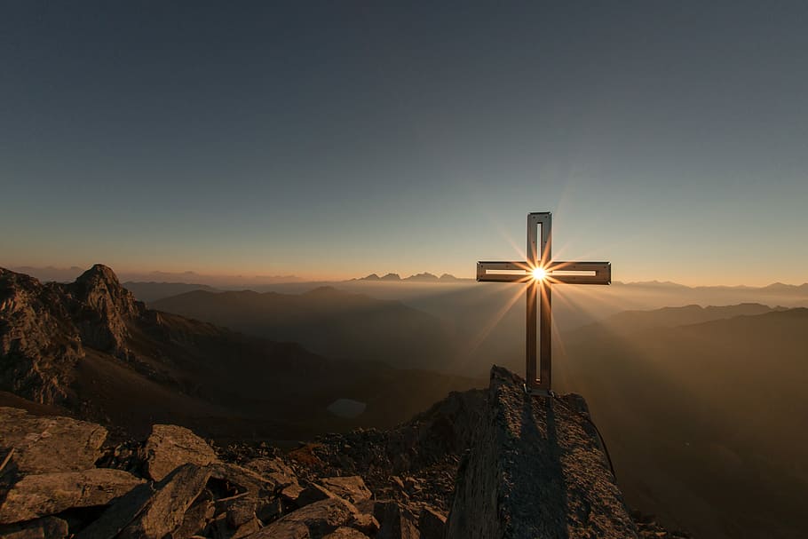 Crossing sun, cross on mountain, summit, sunrise, christian cross