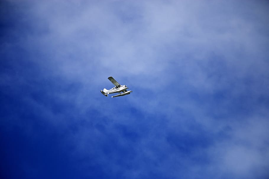 white flying biplane during white and blue sky, white monoplane on sky HD wallpaper