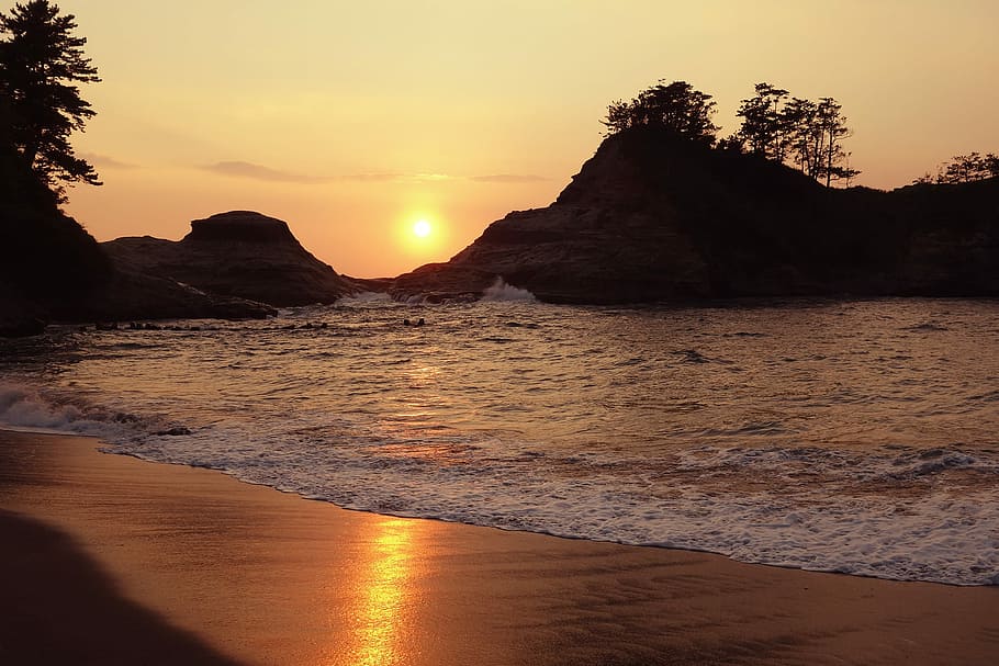 silhouette photo of mountains near sea during golden hour, sunset HD wallpaper