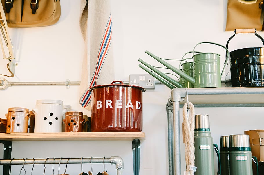 assorted-color ceramic canister on beige wooden rack inside room, metal buckets on rack HD wallpaper