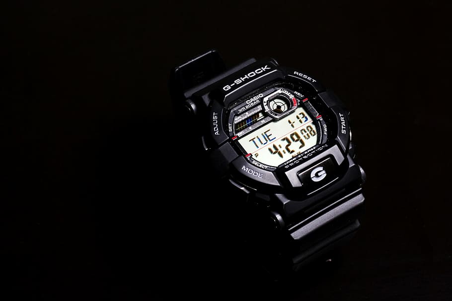 round black Casio G-shock digital watch displaying 4:29, device