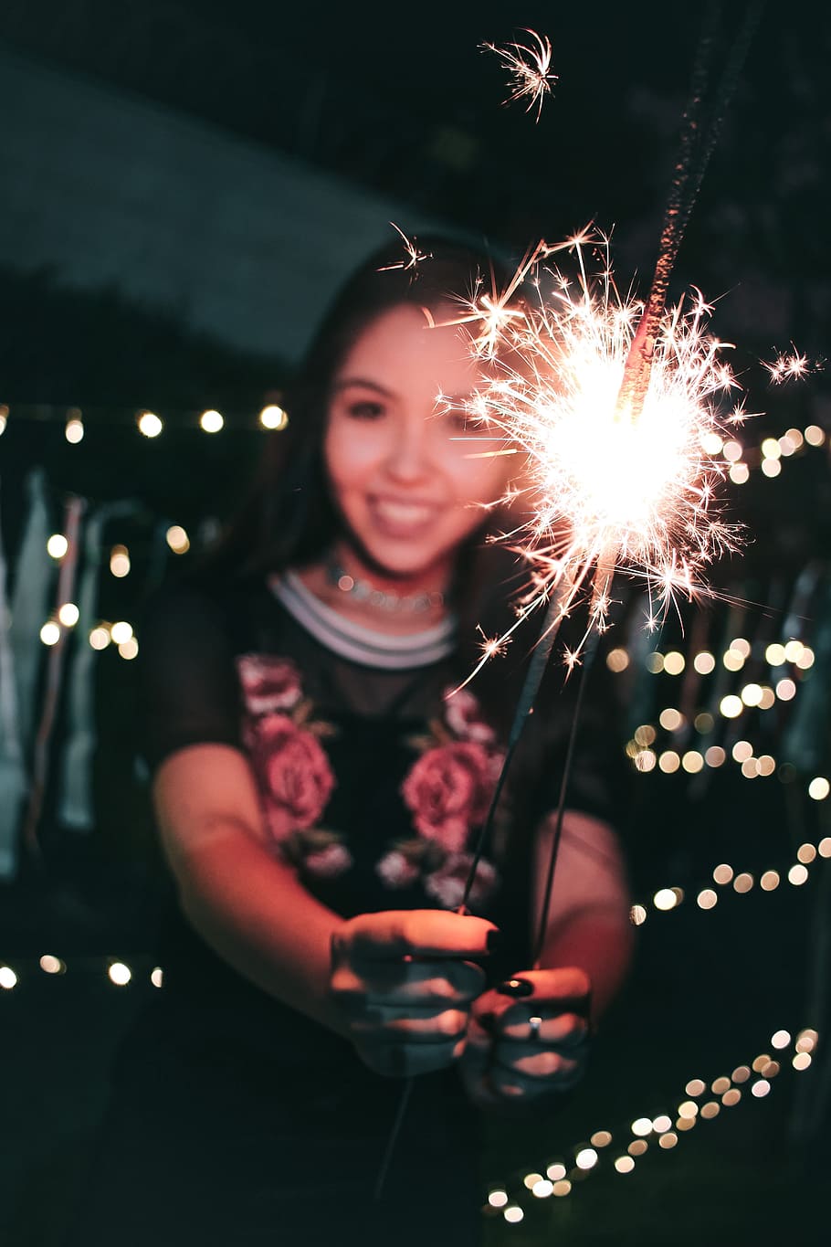Woman Holding Firecrackers, blur, colors, dark, evening, fireworks HD wallpaper