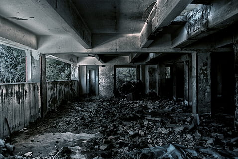 abandoned concrete building surrounded with dirt, rocks and trees during daytime HD wallpaper