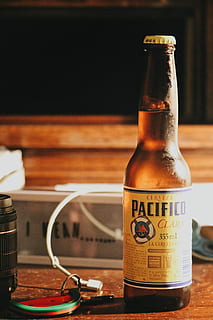 Cerveza Pacifico beer bottle, Cerveza Pacifico bottle on table HD wallpaper