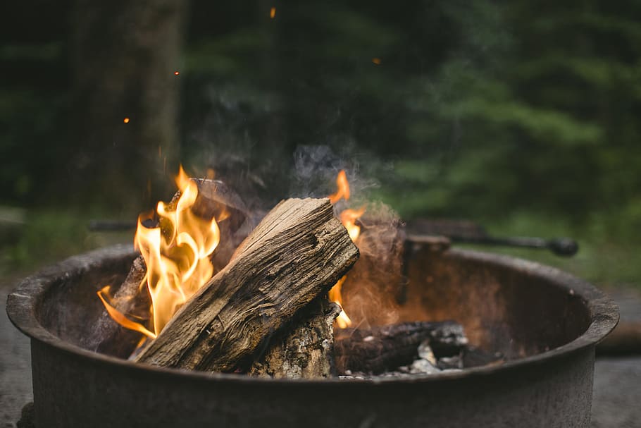 photo of flames on firepit, photography of black fireplace with firewood