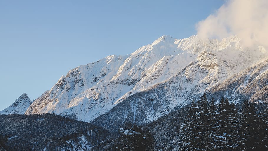 mountain covered with sno, black mountain covered by snow under blue skies HD wallpaper