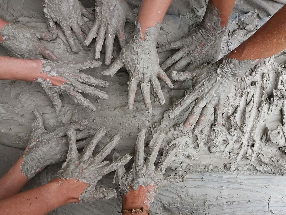 people's hand on gray mud, group of people touching mud, clay HD wallpaper