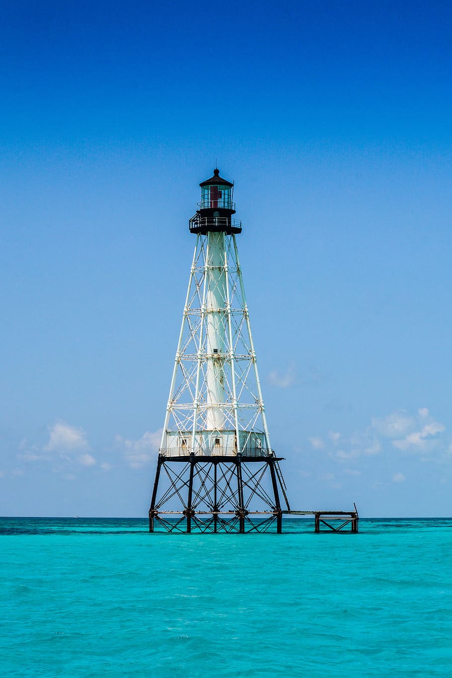white and black steel tower photography, white and black tower in the middle of body of water HD wallpaper