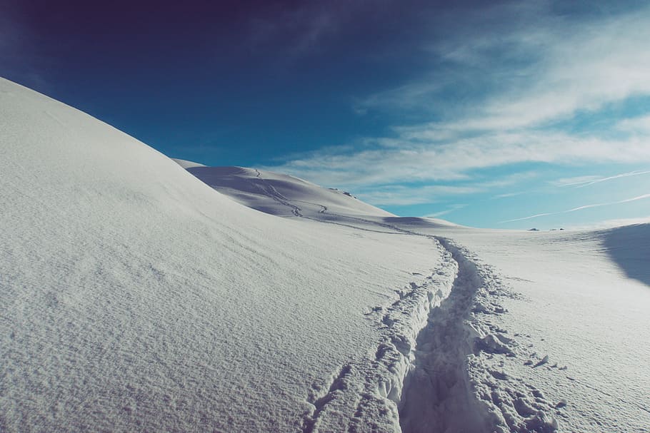 trail left on snow-covered field and hills, white, tracks, mountain HD wallpaper