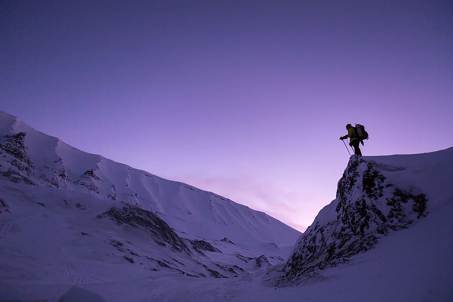 person on snowcap mountain, sunset, hiking, cold, winter landscape HD wallpaper