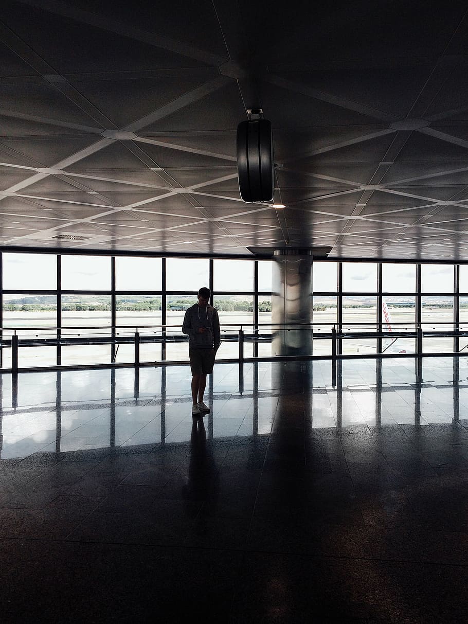 person standing inside the building, guy, man, glass, window HD wallpaper