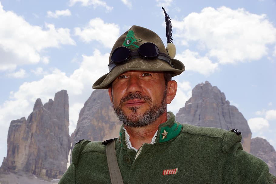 man wearing brown fedora hat, alpine, soldier, three peaks, lavaredo