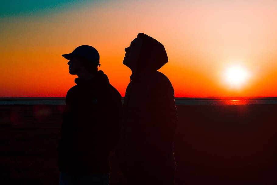 Silhouettes of two men at sunset, people, friends, nature, summer