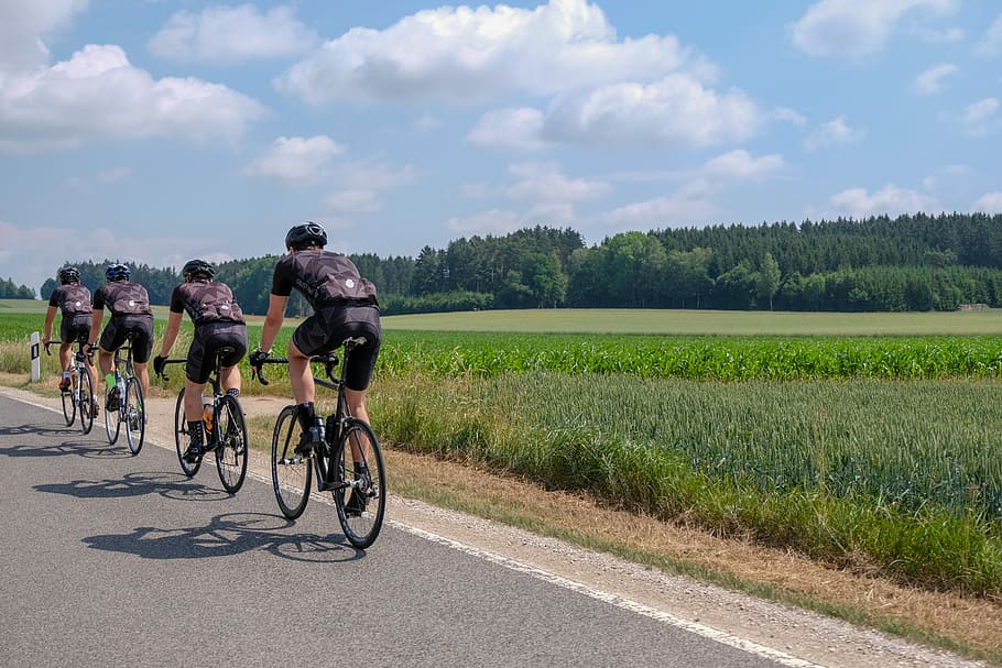 four man riding on bicycles, road bike, cyclists, marathon, sky, HD wallpaper