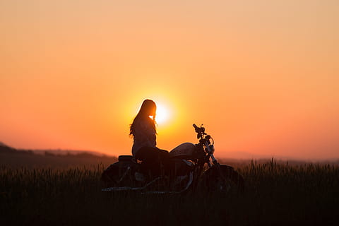 woman riding cruiser motorcycle during golden hour, silhouette of woman riding motorcycle during sunset HD wallpaper