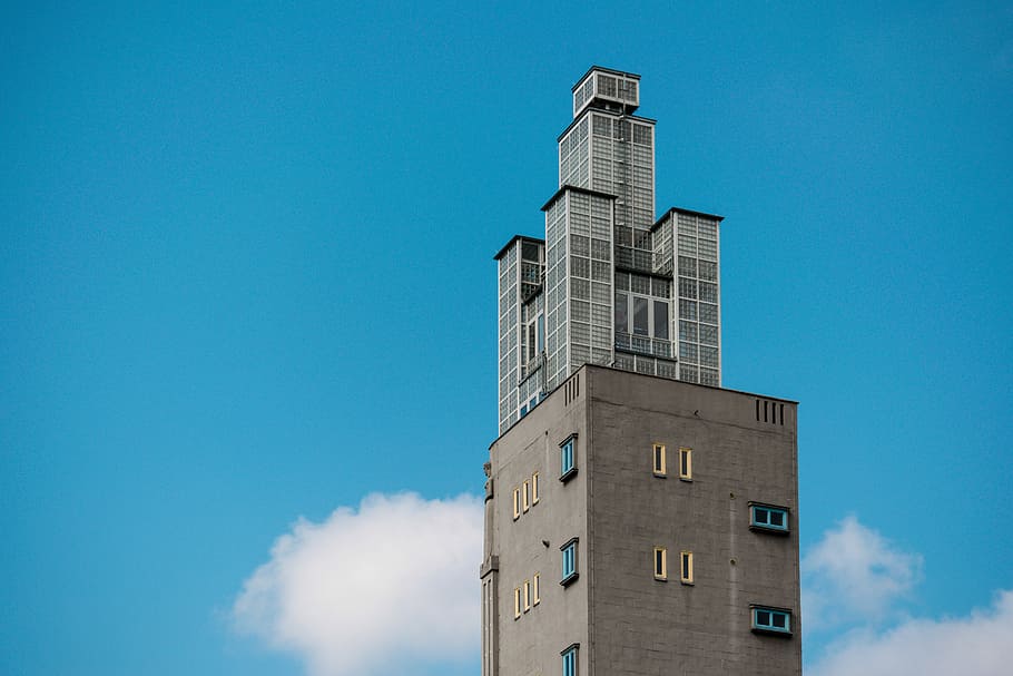 gray concrete building during daytime, low angle photography of gray high-rise building HD wallpaper