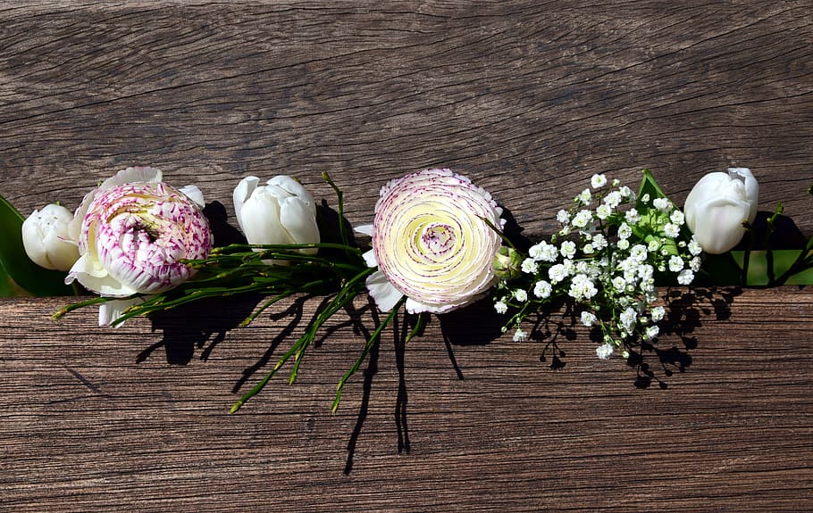 white petaled flowers on a brown wooden crate, bouquet, spring