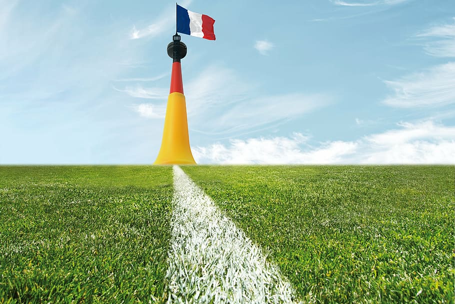 flag of France on tower at daytime, football, playing field, eiffel tower