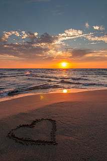 sea waves on seashore with heart drawing at golden hour, background HD wallpaper
