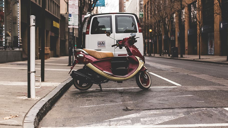 photography of red motor scooter near white van and brown concrete buildings HD wallpaper