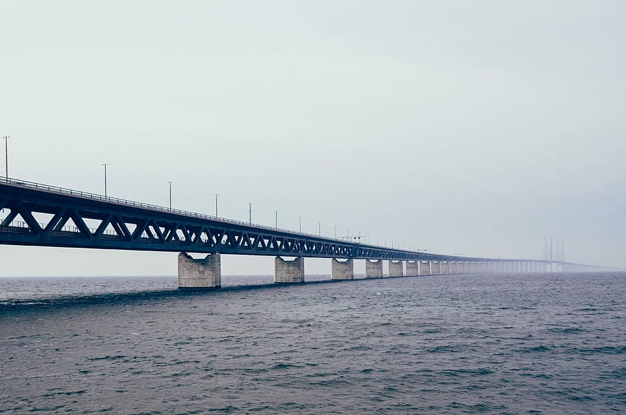 bridge under clear sky above large body of water, bridge - Man Made Structure HD wallpaper