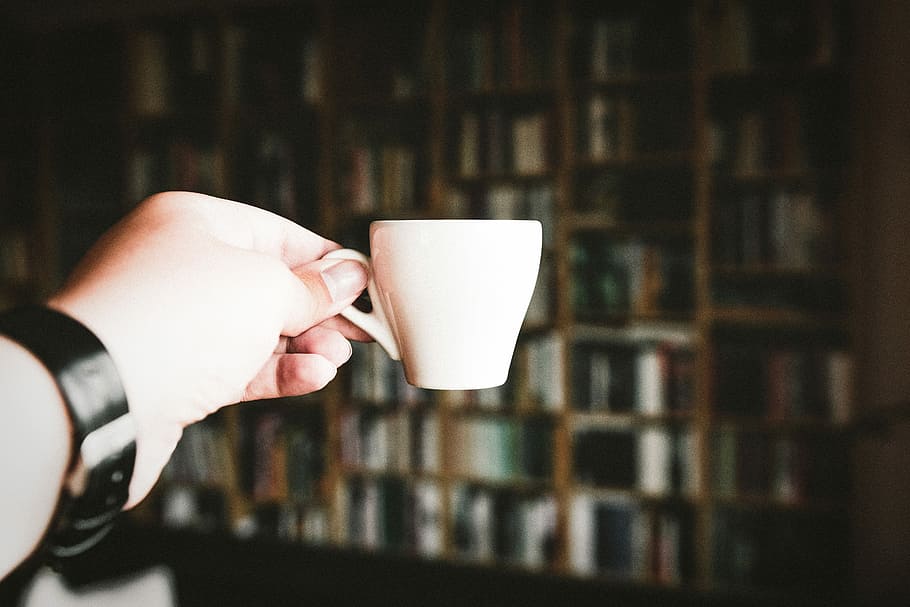 person holding teacup at daytime, selective focus photography of person holding teacup HD wallpaper