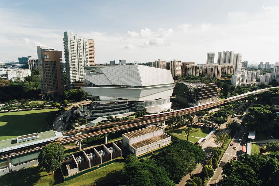 bird's-eye view of white high-rise building beside train track, photo of high-rise building HD wallpaper