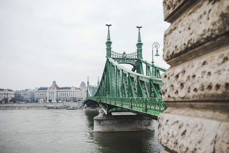 green metal bridge, green suspension bridge, city, water, river HD wallpaper