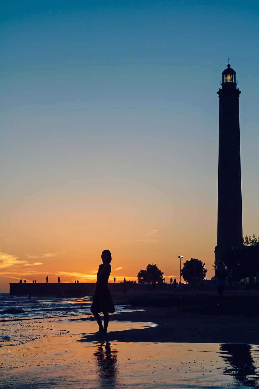 silhouette of woman near lighthouse and body of water, sunset, HD wallpaper