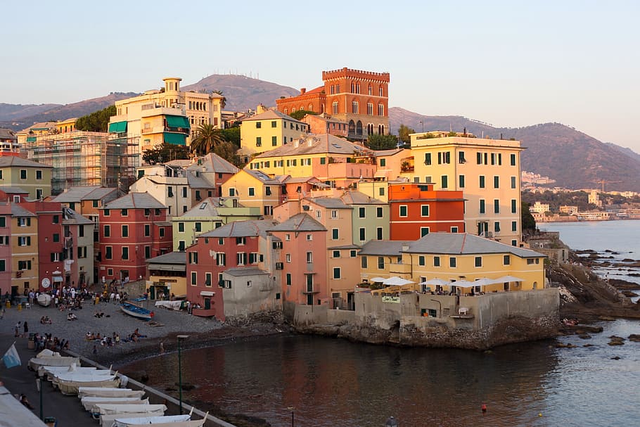 assorted-color concrete house during daytime, cinq terre, colourful houses