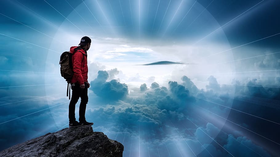 man wearing red hooded jacket; black backpack; black pants HD wallpaper