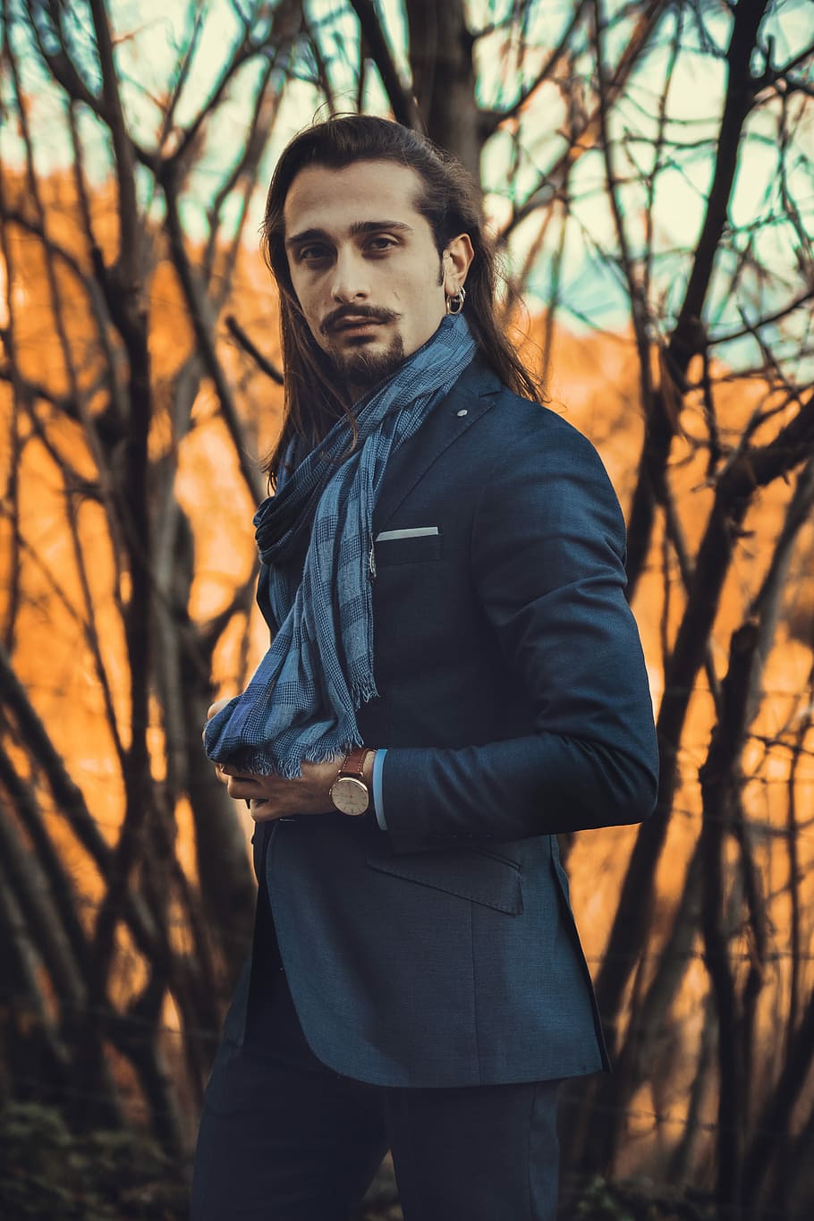 man wearing blue scarf and suit jacket, man walking outdoors near trees HD wallpaper