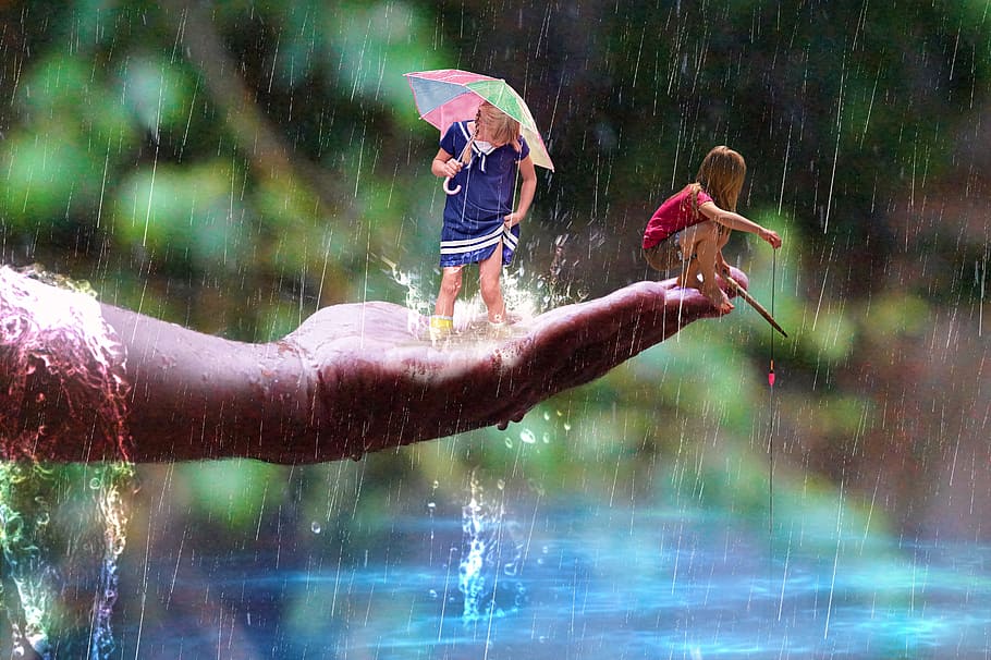two children's enjoying the rain during daytime, leisure, fishing