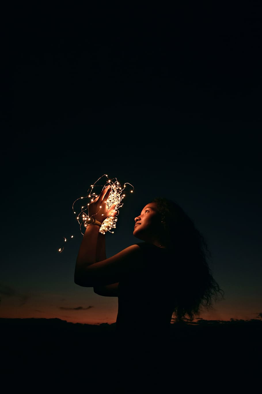 people, darkness, performance, female, one person, holding HD wallpaper