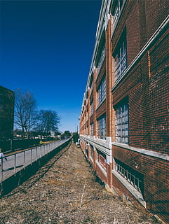 brown brick building, concrete, daytime, bricks, windows, path HD wallpaper