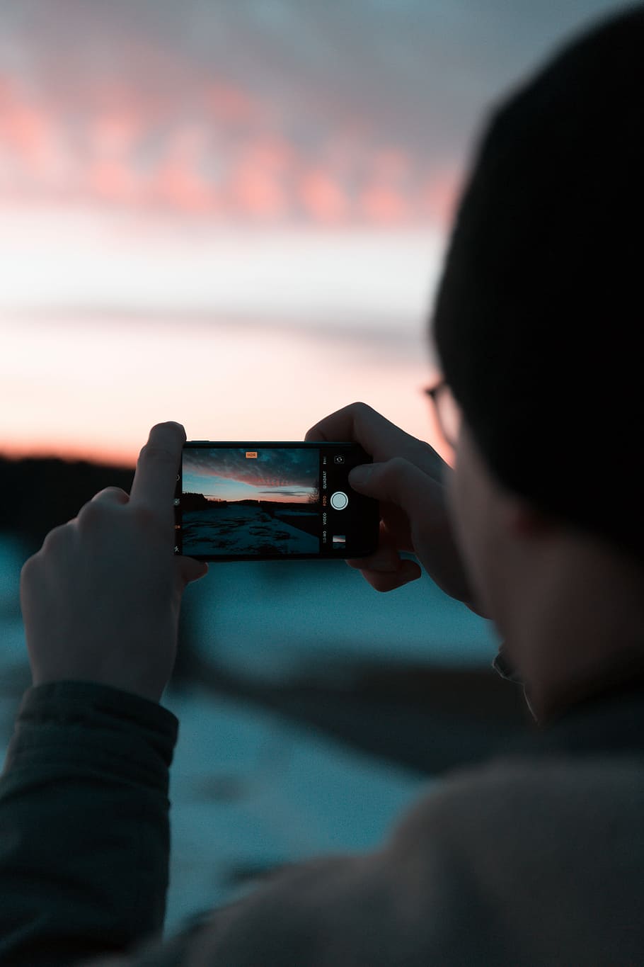 person talking photo of golden hour, person using smartphone capturing sand during sunset HD wallpaper