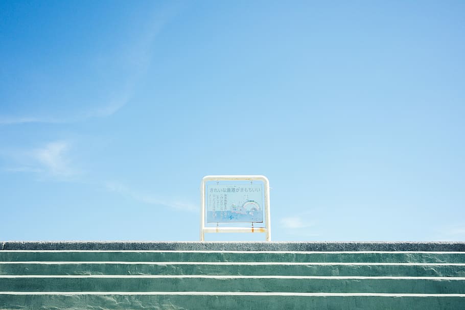 white metal framed board on stairway under blue sky, in distant photo of signage on top of stair HD wallpaper