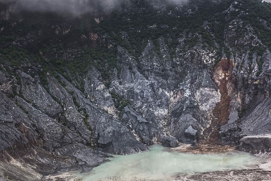 volcano crater surrounded by trees, mist, water, mountain, canyon HD wallpaper