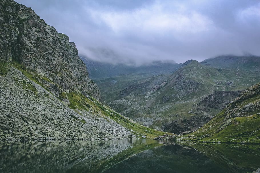 Gray and Green Mountains With Body of Water Under Cloudy Sky HD wallpaper