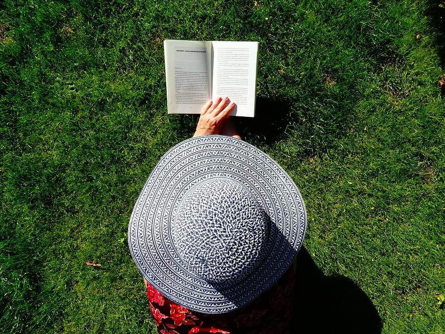 person wearing gray sun hat holding book, read, summer, relax HD wallpaper