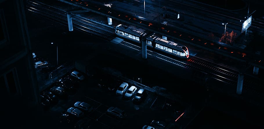 aerial view of piled cars beside train, car park near subway HD wallpaper