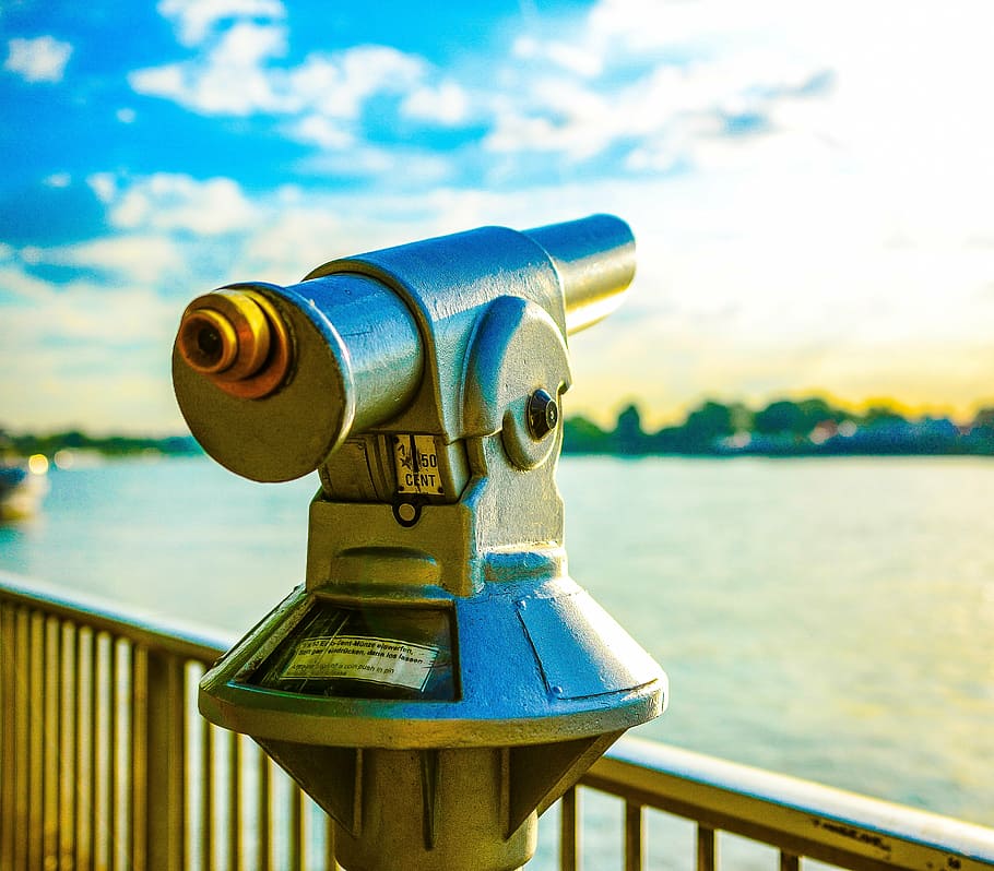 gray telescope overlooking sea at daytime, rhine, river, cologne