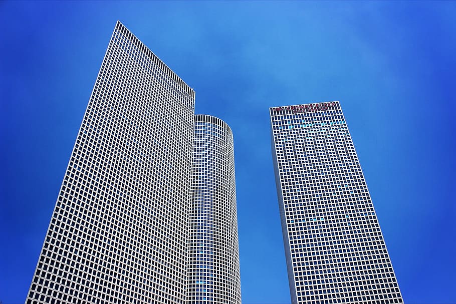 low-angle photography of two high-rise buildings, three, towers