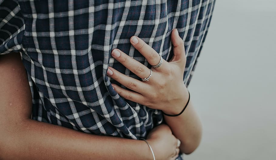 selective focus photography of persons hugging each other, hand HD wallpaper